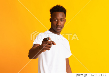Serious african american guy pointing at camera 62902155