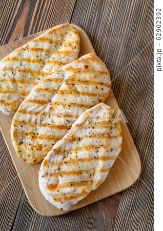 Grilled chicken on serving plate Grilled chicken on serving plate 62902392