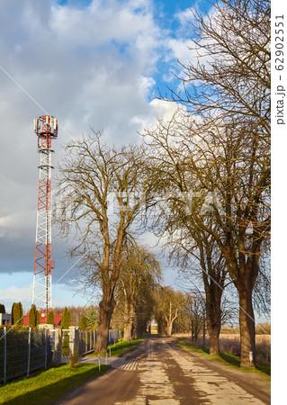 Countryside road with telecommunication tower Countryside road with telecommunication tower 62902551