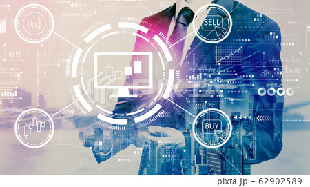 Stock trading theme with businessman holding a tablet Stock trading theme with businessman holding a tablet 62902589