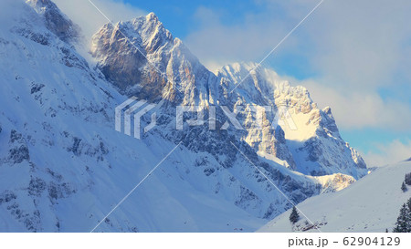 Wonderful snowy winter landscape in the Alps - aerial view 62904129