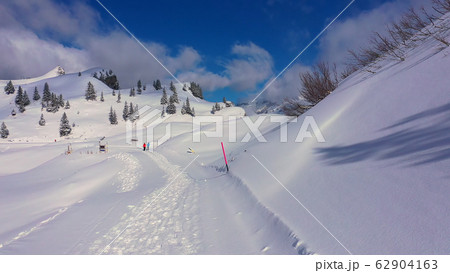 Wonderful snowy winter landscape in the Alps - aerial view 62904163