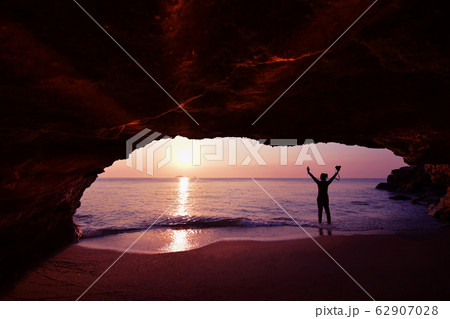 Silhouette of woman standing using camera to take Silhouette of woman standing using camera to take 62907028