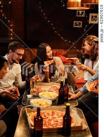 Happy group of friends at the bar having drinks. Happy group of friends at the bar having drinks. 62907619
