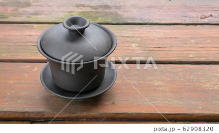 The classic Taiwanese tea cup on old wooden table. 62908320