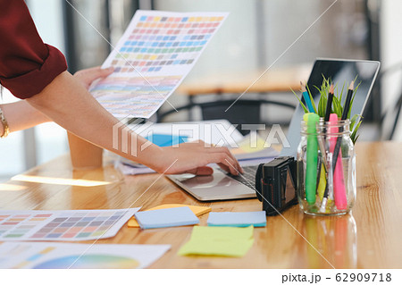 Young photographer and graphic designer at work in Young photographer and graphic designer at work in 62909718