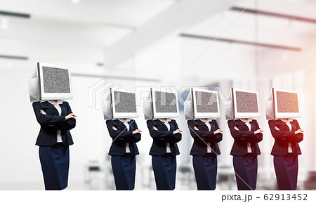 Business women with monitors instead of head. Business women with monitors instead of head. 62913452