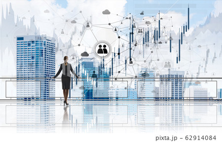 Sunrise above skyscrapers and businesswoman facing new day Sunrise above skyscrapers and businesswoman facing new day 62914084