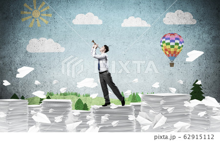 Happy businessman playing fife. 62915112