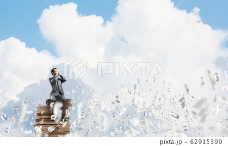 Young man floating in sky and do not want to see anything 62915390
