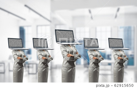 Business women with laptops instead of head. Business women with laptops instead of head. 62915650