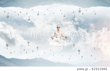 Young woman keeping mind conscious. Young woman keeping mind conscious. 62915666