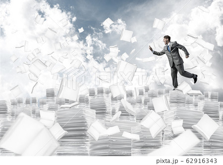 Precise businessman in suit running with phone. Precise businessman in suit running with phone. 62916343
