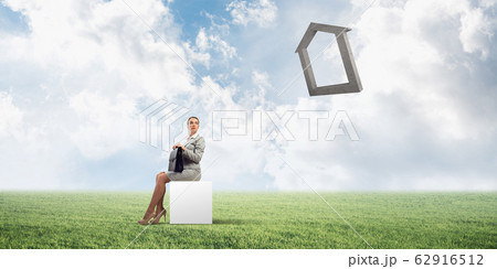 Attractive business lady or accountant outdoors on white box 62916512