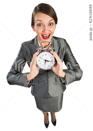 Time management concept with business lady showing alarm clock Time management concept with business lady showing alarm clock 62916699