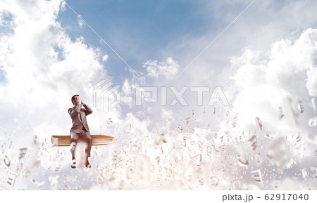 Young man floating in sky and do not want to see anything 62917040