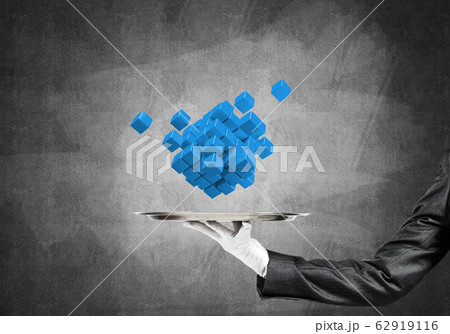 Hand of waitress presenting cubes on tray. 62919116