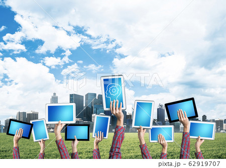 Close of woman hands in line showing tablet pc with blank blue s Close of woman hands in line showing tablet pc with blank blue s 62919707