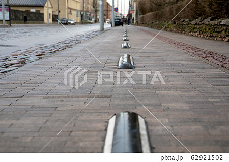 Paved car park. Pedestrian sidewalk, Urban background Paved car park. Pedestrian sidewalk, Urban background 62921502