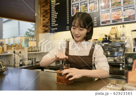 Portrait of young woman and man, part timer and owner 403 62923565