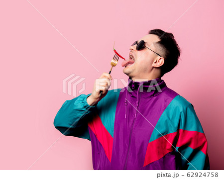 Style guy in glasses with chili pepper on a fork 62924758