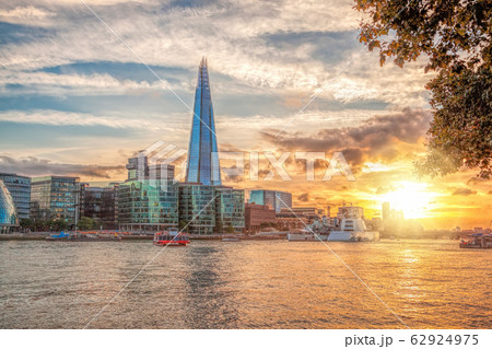 skyline with modern architecture against colorful sunset in London, England, UK skyline with modern architecture against colorful sunset in London, England, UK 62924975