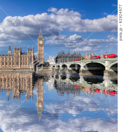 Big Ben and Houses of Parliament with red buses on the bridge in London, England, UK 62924977