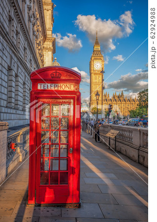 London with red phone booth against Big Ben in England, UK 62924988