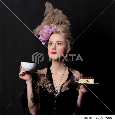 Beautiful blonde countess with cake and cup Beautiful blonde countess with cake and cup 62927960