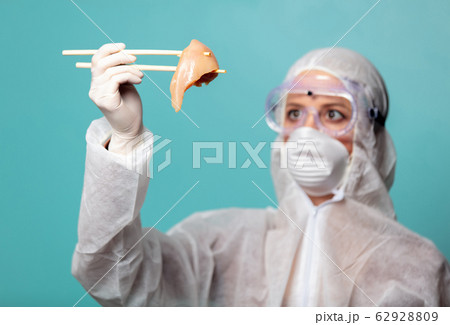 medic woman wearing protective clothing against 62928809