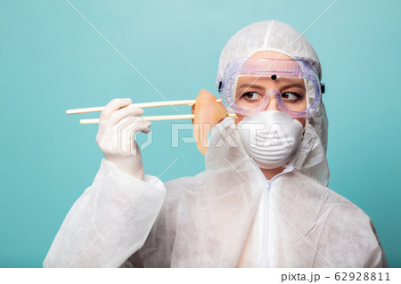 medic woman wearing protective clothing against 62928811