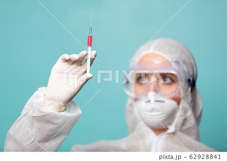 medic woman wearing protective clothing against medic woman wearing protective clothing against 62928841