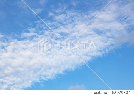 Clouds on the blue sky, blurred background Clouds on the blue sky, blurred background 62929384