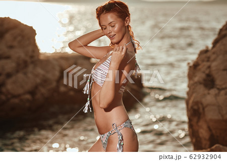Bikini girl on the beach. Young beautiful woman in Bikini girl on the beach. Young beautiful woman in 62932904