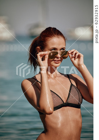 Bikini girl on the beach. Young beautiful woman in Bikini girl on the beach. Young beautiful woman in 62932915