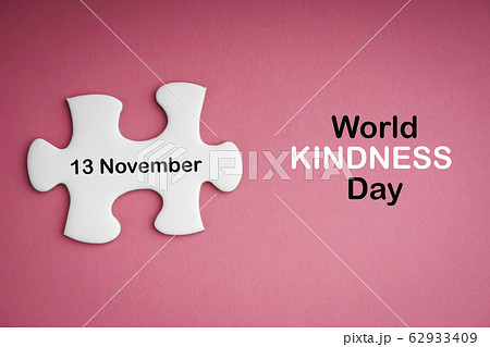 WORLD KINDNESS DAY text with white jigsaw puzzle WORLD KINDNESS DAY text with white jigsaw puzzle 62933409