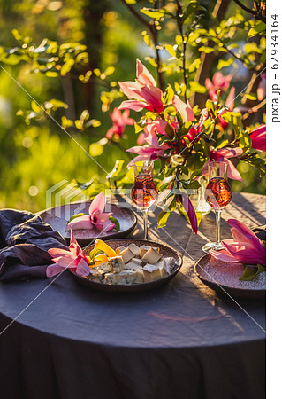 Beautiful table setting in garden on sunset light. 62934164