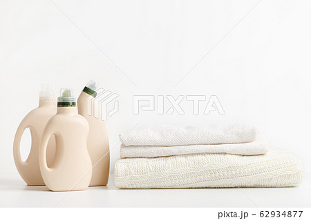 Pile of folded clean towels with bio bottles packaging Pile of folded clean towels with bio bottles packaging 62934877