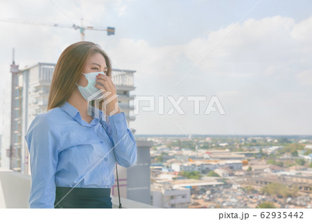 Asian woman wearing mask sick and pollution in the Asian woman wearing mask sick and pollution in the 62935442