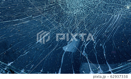 Cracked glass from car crash accidental with selective focusing Cracked glass from car crash accidental with selective focusing 62937338