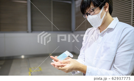 Asian man using hand sanitizer gel washing hand 62937775