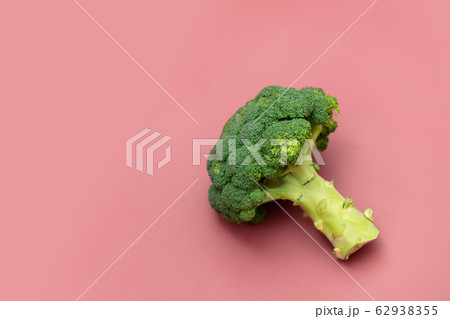 Fresh broccoli on pink background Fresh broccoli on pink background 62938355