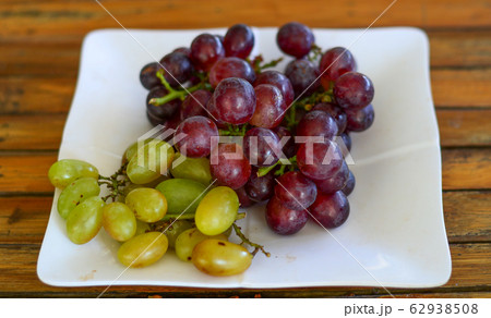 Grapes on the vine at summer day 62938508
