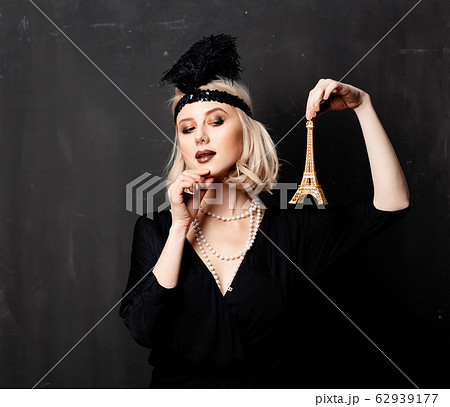 Beautiful blonde woman in twenties years clothes Beautiful blonde woman in twenties years clothes 62939177