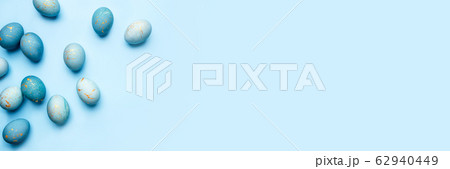 Easter frame of eggs painted in blue color. 62940449