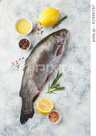 Raw rainbow trout light background Raw rainbow trout light background 62940787