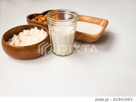 Homemade almond milk in a glass, almonds, milk and 62941063