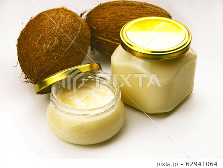 Solid homemade coconut oil in glass jar with metal 62941064