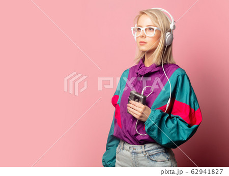woman in 90s clothes with headphones woman in 90s clothes with headphones 62941827