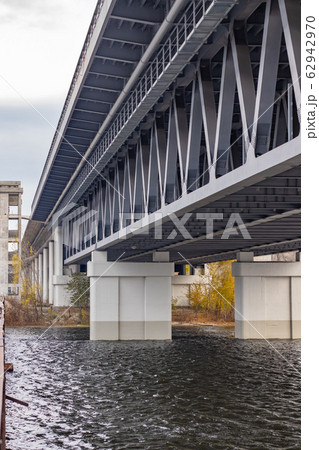 Metal framework of unfinished grey bridge in Kyiv. Bridge construction 62942970